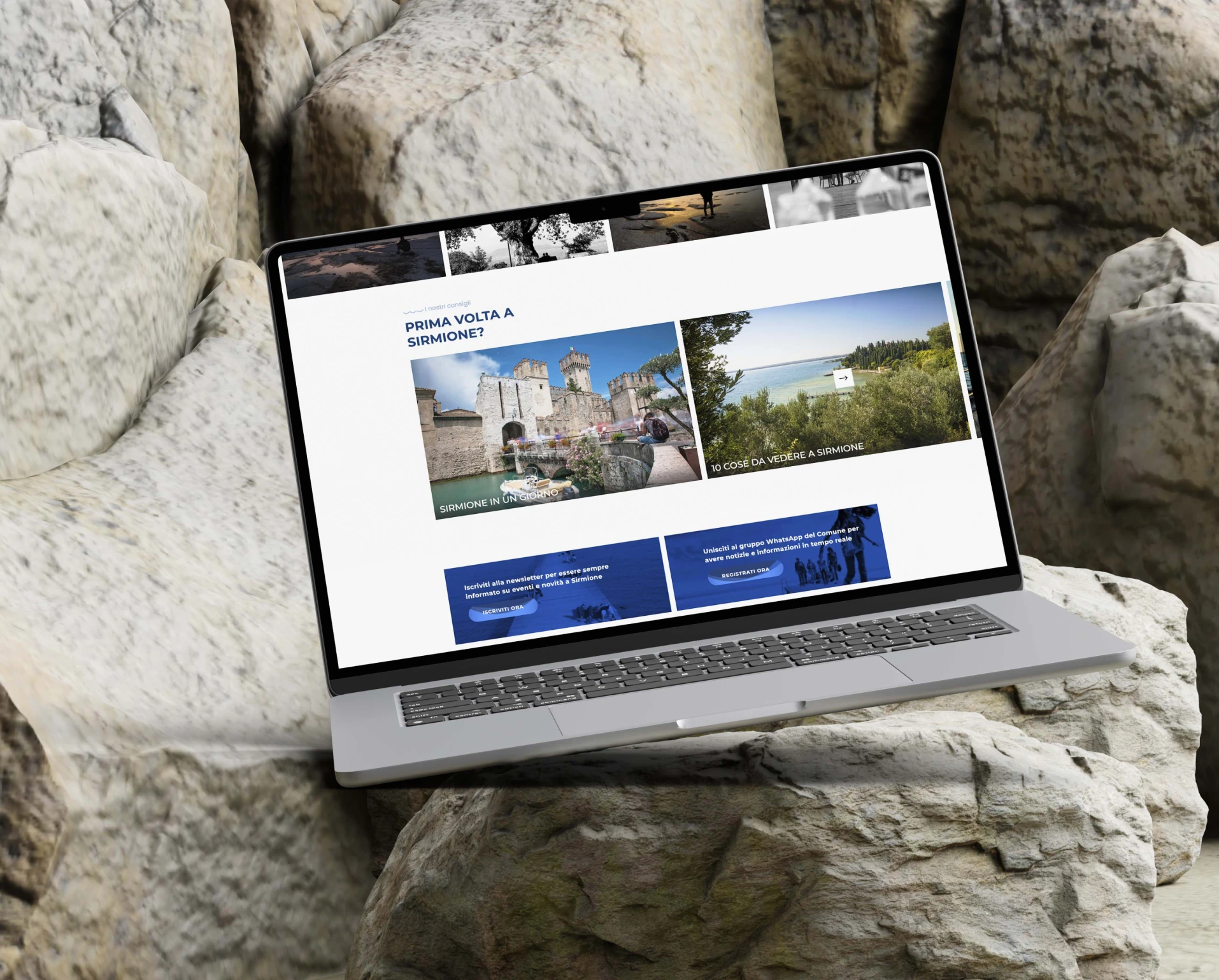 laptop appoggiato sulla rocchia, l'interfaccia mostra la home di visitsirmione.com